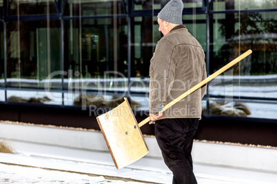 Man with snow shovel