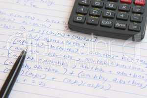 pen, calculator and maths homework