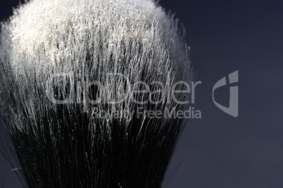 makeup brush with white powder