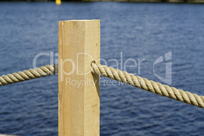 rope through wooden pole