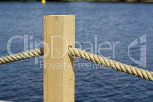 rope through wooden pole