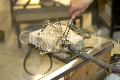 At work in a glas-blower factory