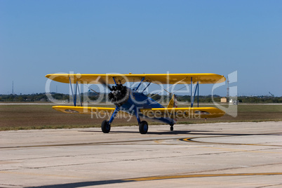 Aircraft vintage bi-plnae taxiing f