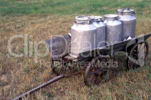 Milk cans on a small wagon