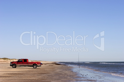 Truck on beach fishing in Texas