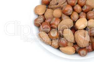 Bowlful of walnuts almonds and haze