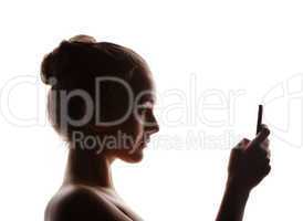 profile  woman in a shade of a silhouette with phone, isolated o