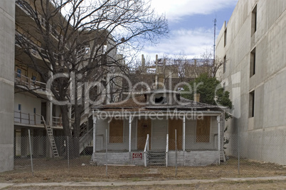 House surrounded by industry