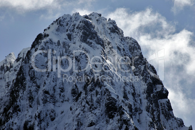 Rugged, sharp snow covered mountain