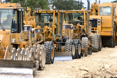 Caterpillar earth movers lined up