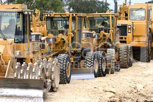 Caterpillar earth movers lined up