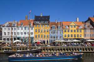 Tour boat in Nyhavn Canal Copenhage