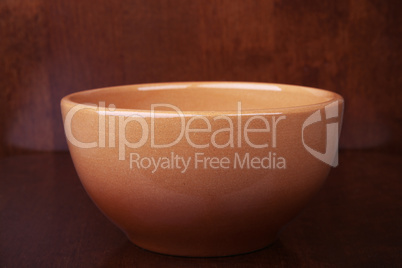 clay bowl on a wooden background