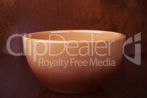 clay bowl on a wooden background