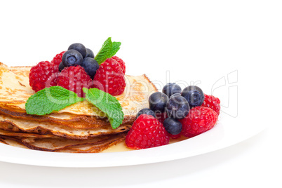 Delicious Freshly Prepared Pancakes with Honey and Berries