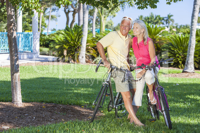 Happy Senior Couple on Bicycles In Green Park