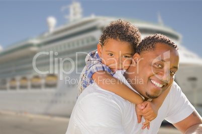 Mixed Race Father and Son In Front of Cruise Ship