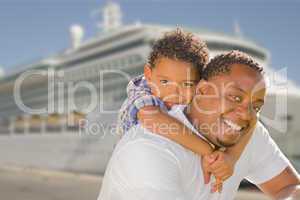 Mixed Race Father and Son In Front of Cruise Ship