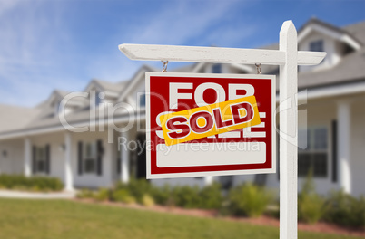 Sold Real Estate Sign and House