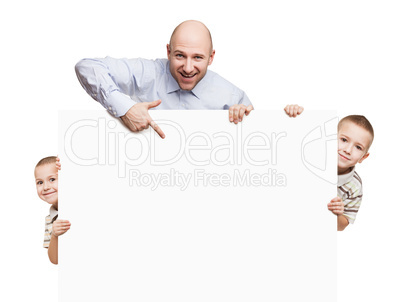 Father and sons holding blank sign or placard