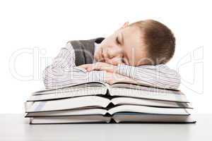 Child sleeping on reading books