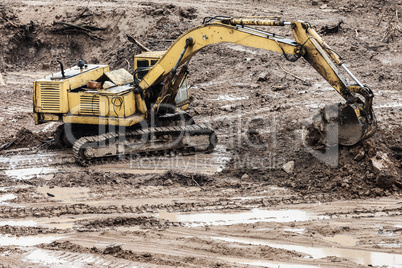 Digging excavator machine at building construction site