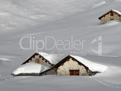 Lots of snow in the alps, snow covered huts