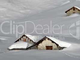 Lots of snow in the alps, snow covered huts