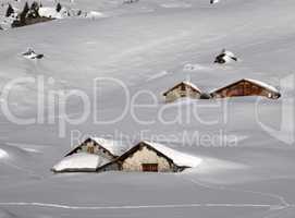 Huts covered by lots of snow
