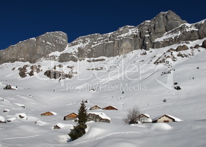 Snow covered huts in the Swiss Alps, Braunwald