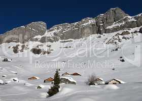 Snow covered huts in the Swiss Alps, Braunwald