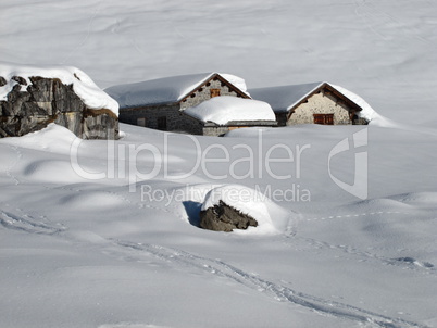 Idyllic winter scene, snow covered huts, Braunwald