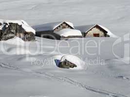 Idyllic winter scene, snow covered huts, Braunwald
