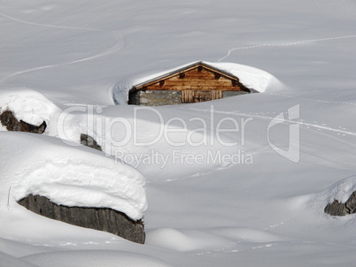 Snow covered hut in Braunwald, Glarus Canton