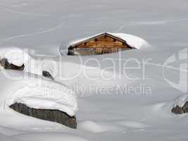 Snow covered hut in Braunwald, Glarus Canton