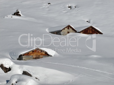 Snow covered huts in the Swiss Alps