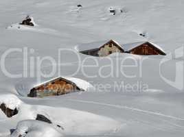 Snow covered huts in the Swiss Alps