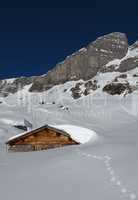 Snow landscape in Braunwald, hut