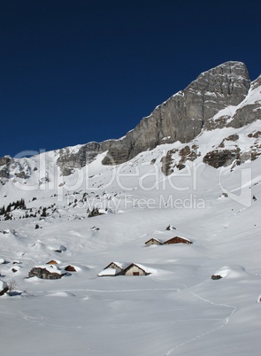 Winter scenery in the mountains, huts