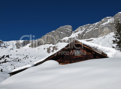 Hut in the snow, mountains