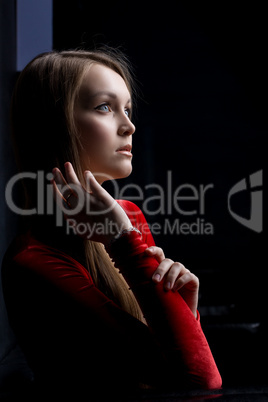 Beauty young woman portrait in dark