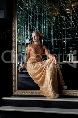 Woman sitting on sofa in nightclub