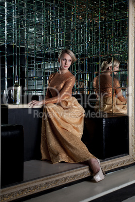 Woman sitting on sofa in club