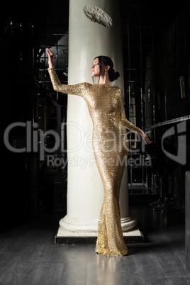 Beautiful and fashion woman in gold dress