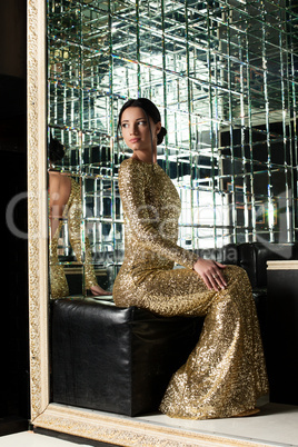 Beautiful woman in gold dress