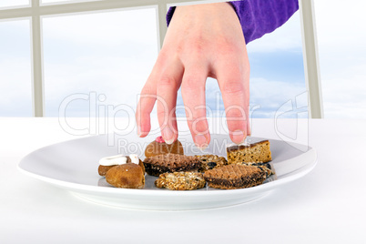 Hand reaching through the window to the cake plate