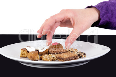 Hand reaching for cake plate