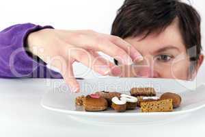 Woman reaching for cake plate