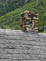 Stone Chimney and Cedar Roof Shingl