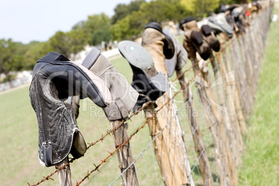 Boots on fence posts